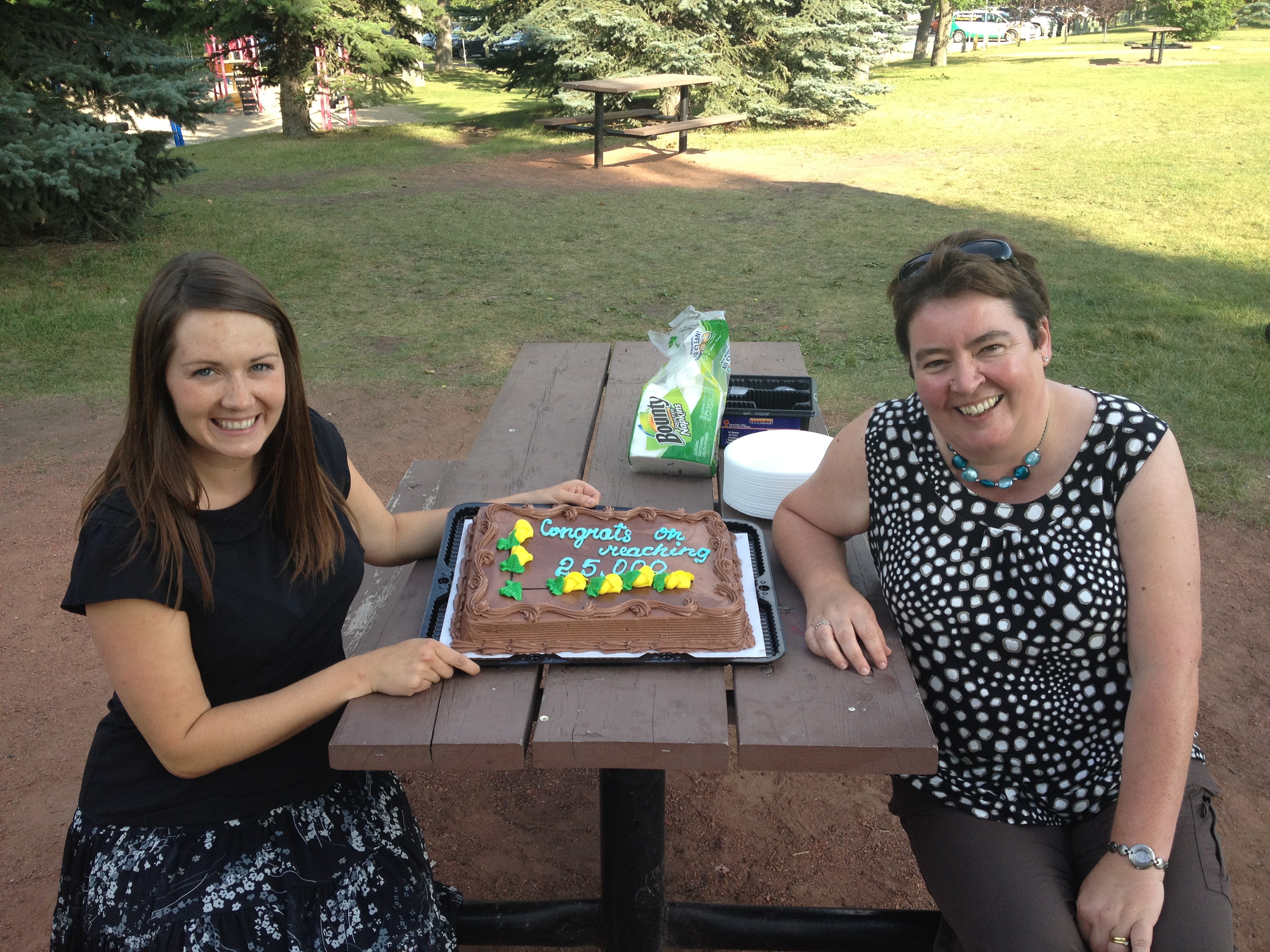 Amanda Davison (left) and Dr. Paula Robson sitting at a picnic table